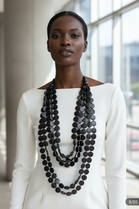 Black Woman Wearing Black Multi-Layered Beaded Necklace