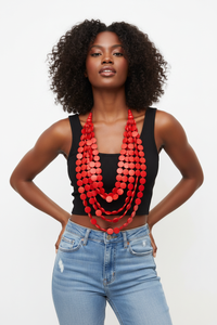 Black Woman Wearing Red Multi-Layered Beaded Necklace