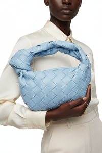 Dark model with sky blue woven knot bag