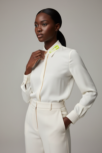 Ivory silk blouse with yellow safety pin