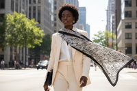 Model wearing scarf with blazer